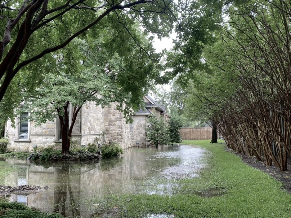 Before: standing water along the Southlake side yard days after a rain, with no exit path
